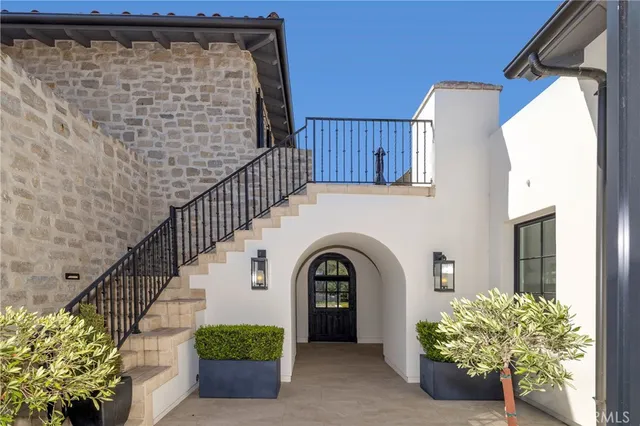 a view of entryway with flower pots