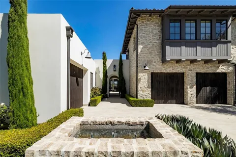 a view of a white building with many windows
