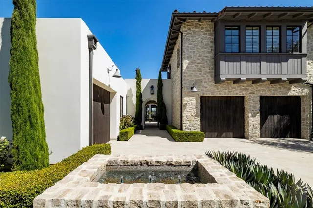 a view of a white building with many windows