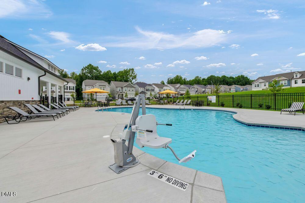 190 Hank Way Angier, NC 27501 - Photo 18 of 48 a view of a swimming pool and a terrace