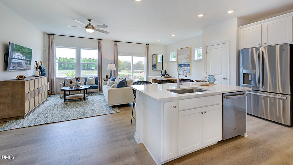 190 Hank Way Angier, NC 27501 - Photo 8 of 48 a kitchen with sink refrigerator and large window