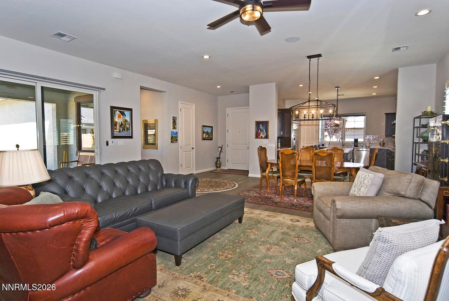 2332 Hammer Falls Drive Reno, NV 89521 - Photo 13 of 57 a living room with furniture and a chandelier