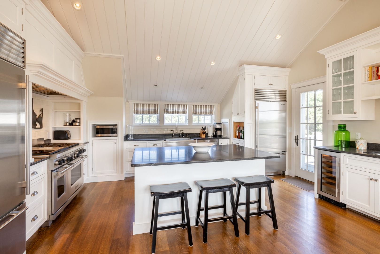 24 Katama Bay View Road Edgartown, MA 02539 - Photo 22 of 26 a large kitchen with a table and chairs