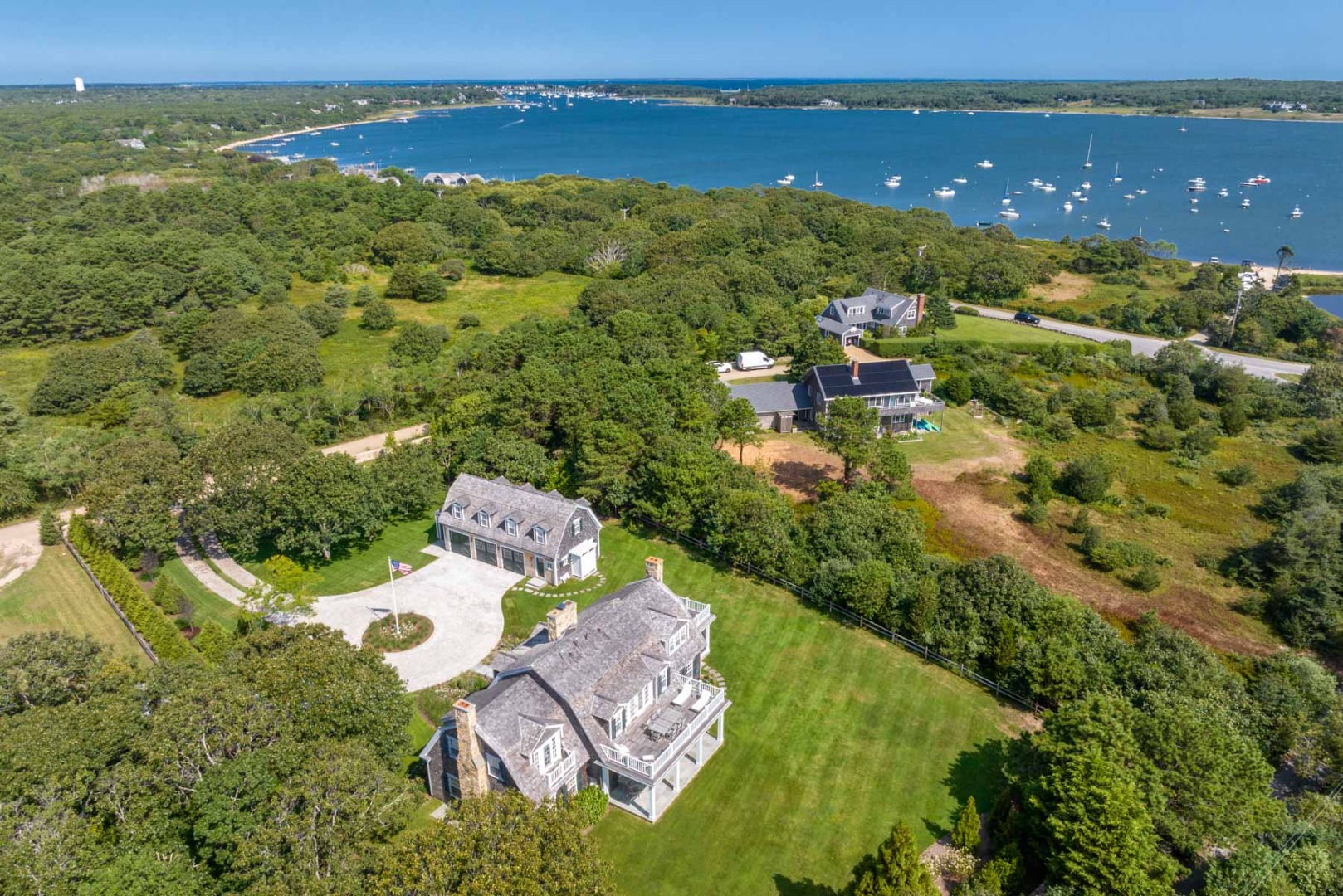 24 Katama Bay View Road Edgartown, MA 02539 - Photo 6 of 26 an aerial view of a house with a garden and lake view