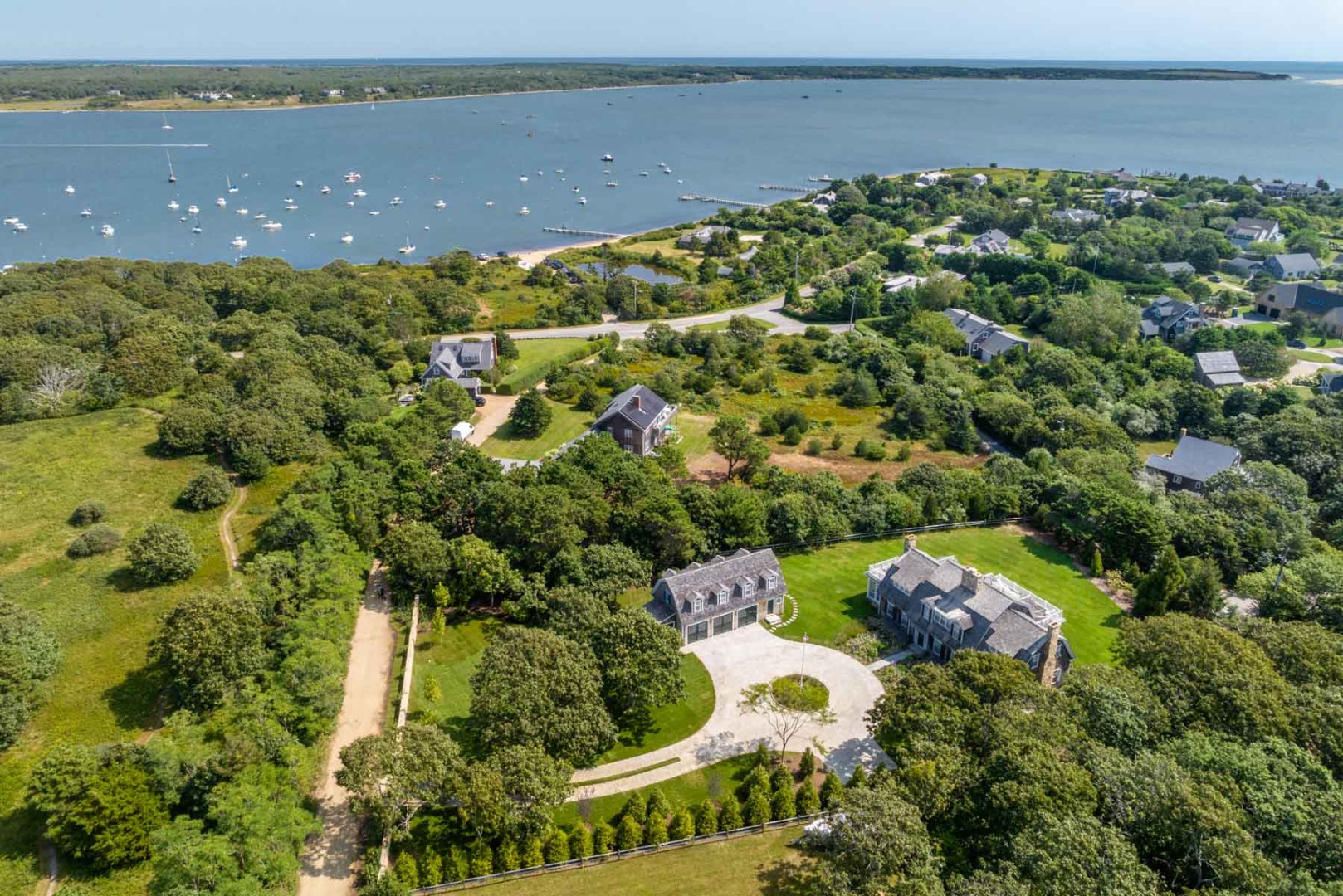 24 Katama Bay View Road Edgartown, MA 02539 - Photo 7 of 26 a view of a lake with a building in the background