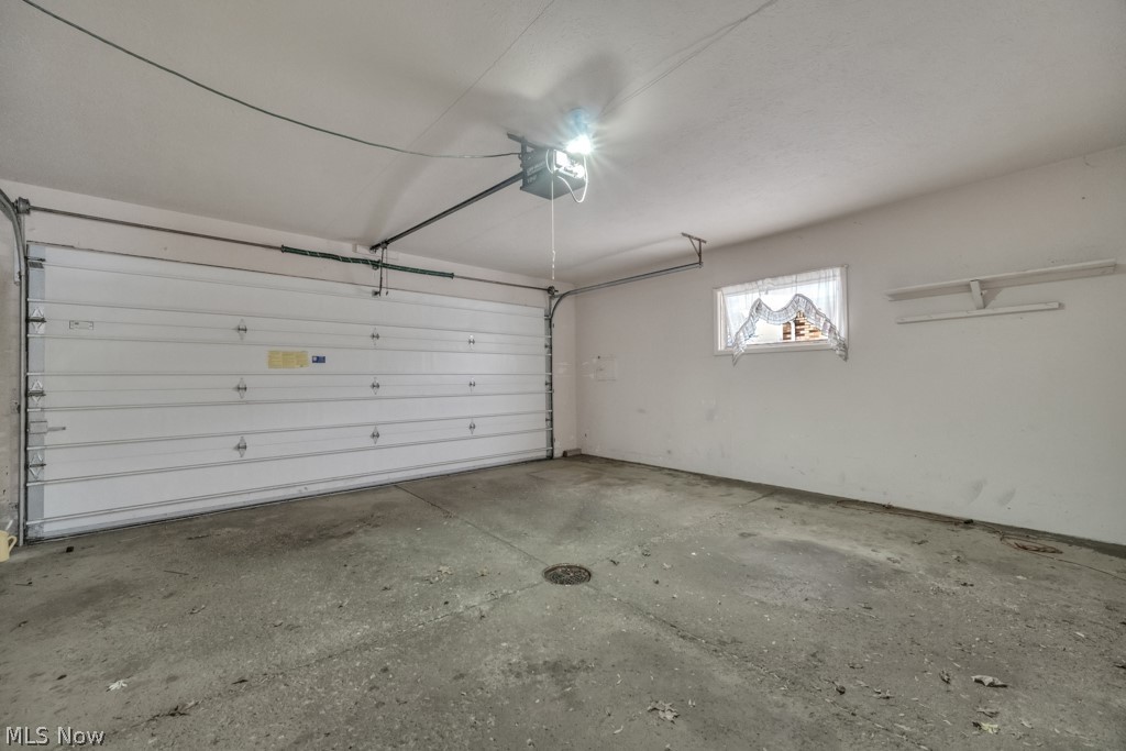 6846 Revere Road Cleveland, OH 44130 - Photo 30 of 30 Garage featuring a garage door opener