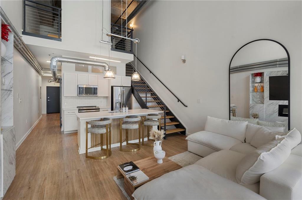 260 18th Street Northwest, Unit 10224 Atlanta, GA 30363 - Photo 11 of 47 a living room with furniture