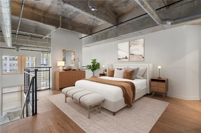 a bed room with bed and a chair