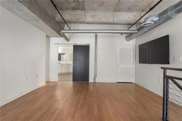 a view of a livingroom with wooden floor