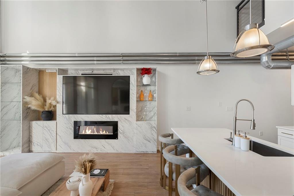 260 18th Street Northwest, Unit 10224 Atlanta, GA 30363 - Photo 2 of 47 a living room with furniture and a fireplace