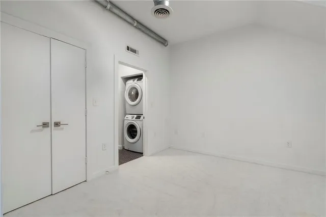 a view of a big room with closet and a bathroom