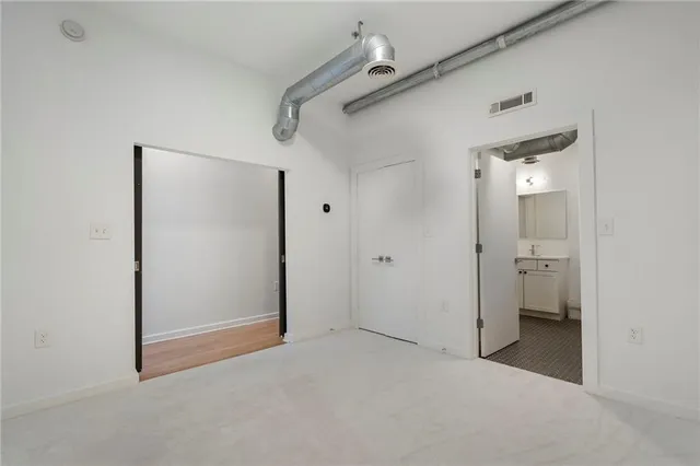 a bathroom with a bathtub sink mirror and toilet