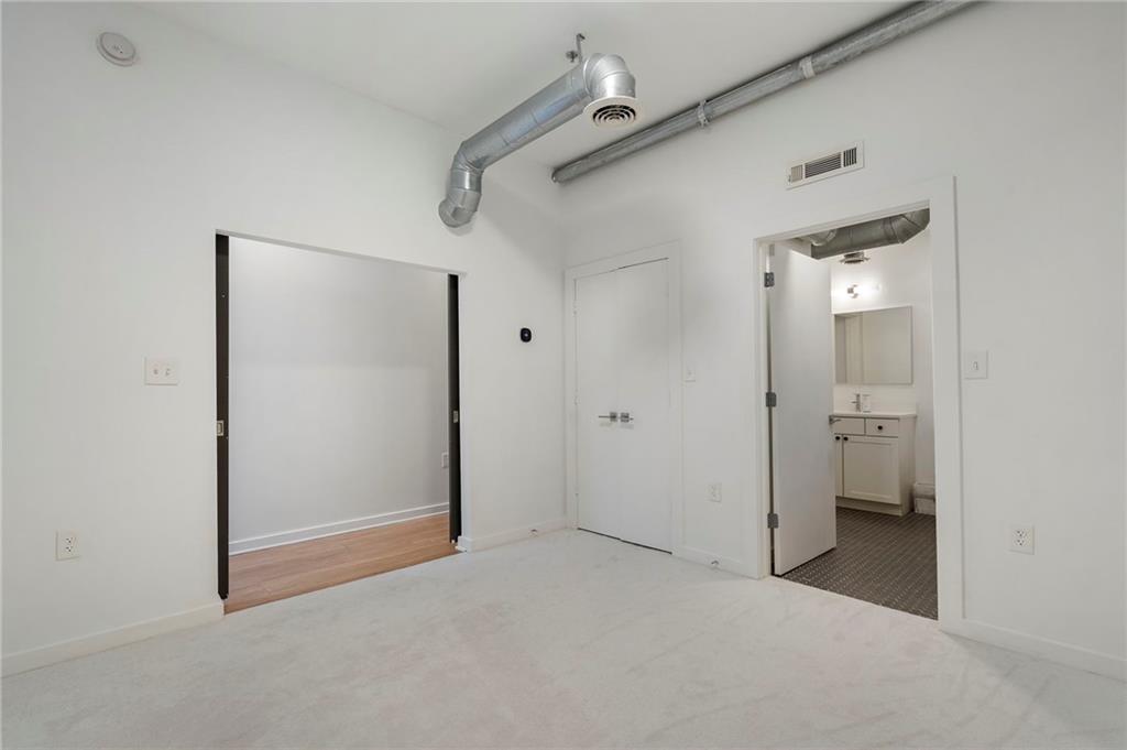 260 18th Street Northwest, Unit 10224 Atlanta, GA 30363 - Photo 24 of 47 a view of a big room with closet and a bathroom