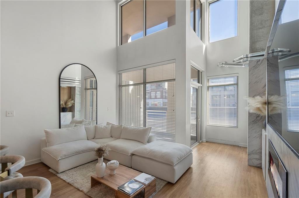 260 18th Street Northwest, Unit 10224 Atlanta, GA 30363 - Photo 3 of 47 a living room with furniture and a large window