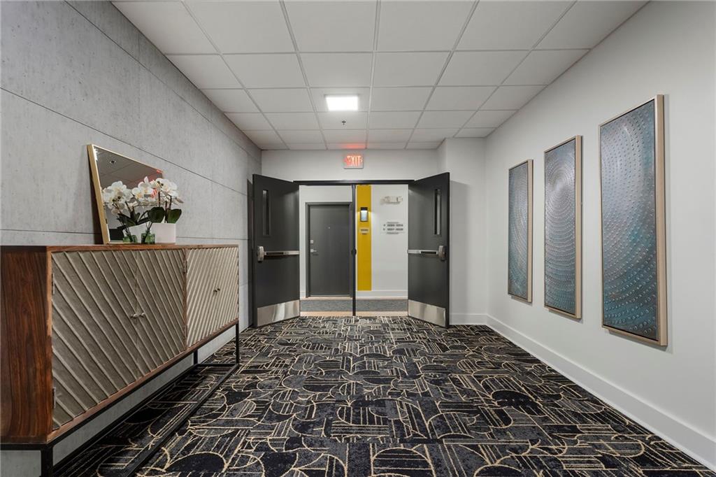 260 18th Street Northwest, Unit 10224 Atlanta, GA 30363 - Photo 33 of 47 a view of a hallway with wooden floor