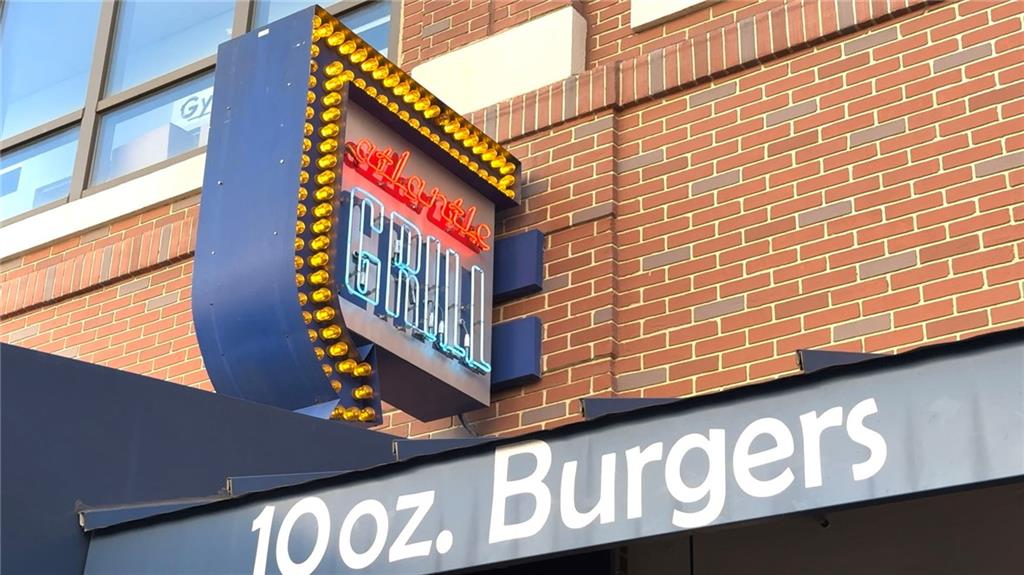 260 18th Street Northwest, Unit 10224 Atlanta, GA 30363 - Photo 42 of 47 a street sign on a brick wall