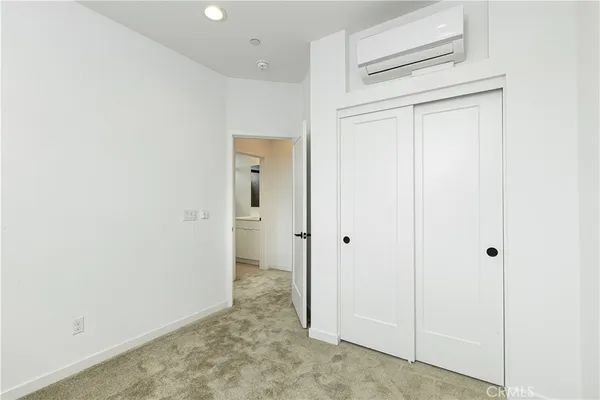 a view of a hallway with closet area