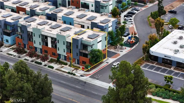 an aerial view of multi story residential apartment building