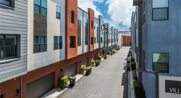 a view of a street with tall buildings