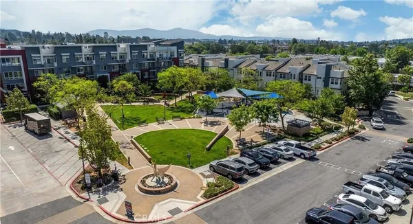 an aerial view of a house with garden space and street view