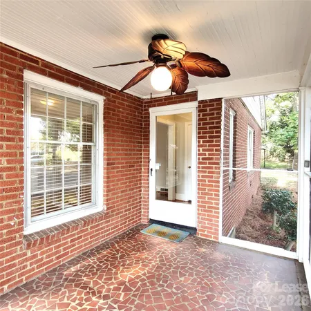 a view of a livingroom with a ceiling fan and a window