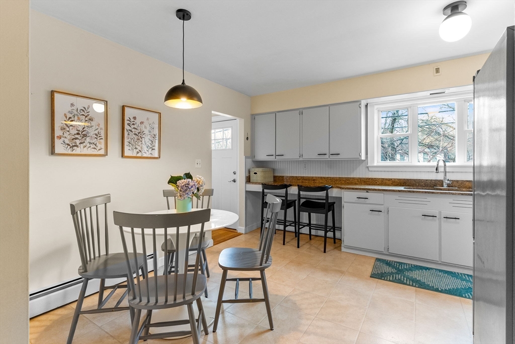 60 Goshen Road Dedham, MA 02026 - Photo 11 of 37 a dining room that has a dining table and chairs