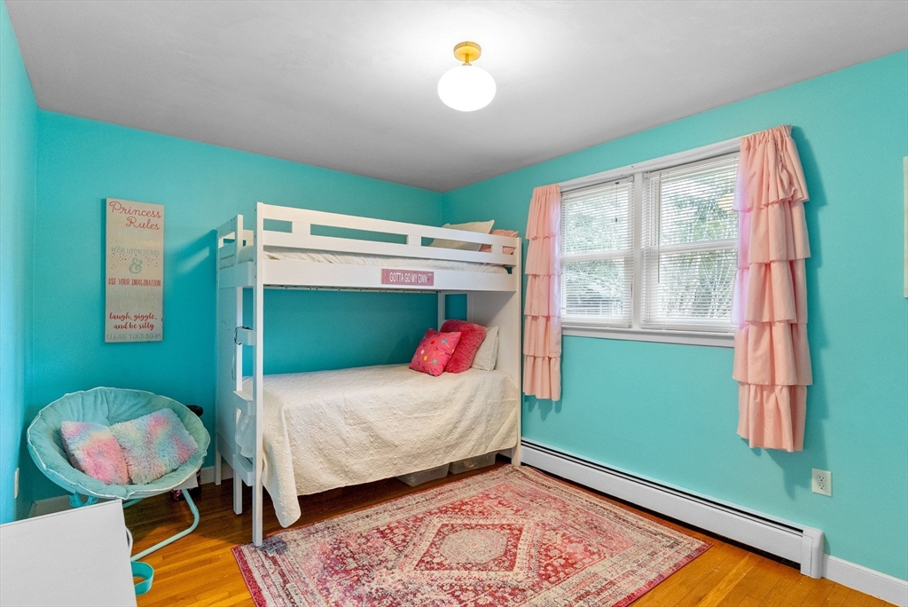 60 Goshen Road Dedham, MA 02026 - Photo 15 of 37 a bedroom with a bed and windows