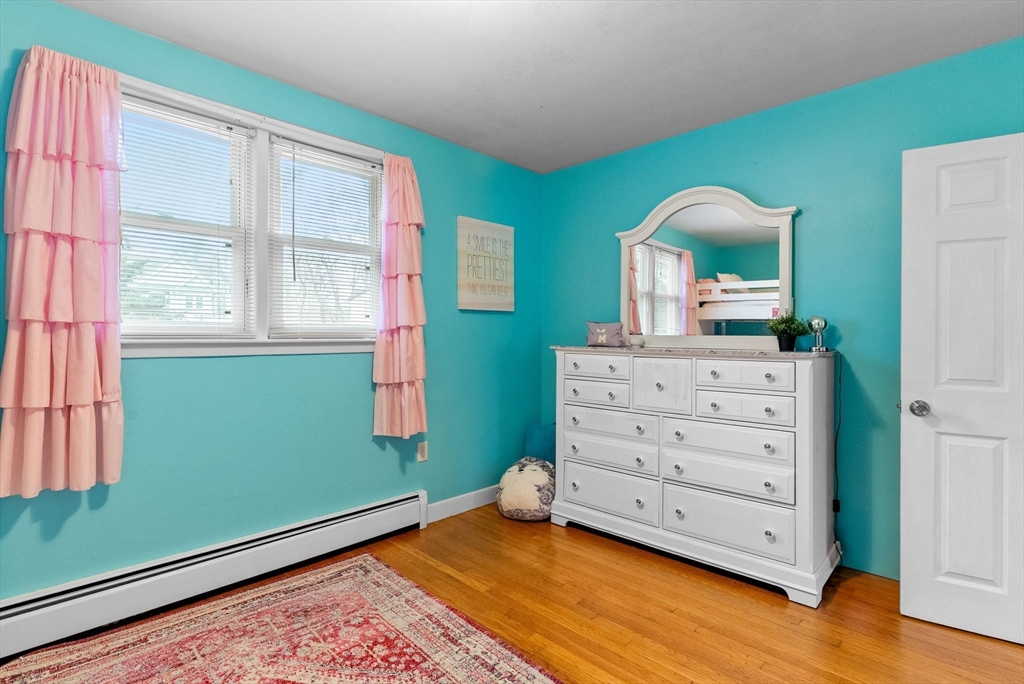 60 Goshen Road Dedham, MA 02026 - Photo 16 of 37 a room with a dresser with two windows