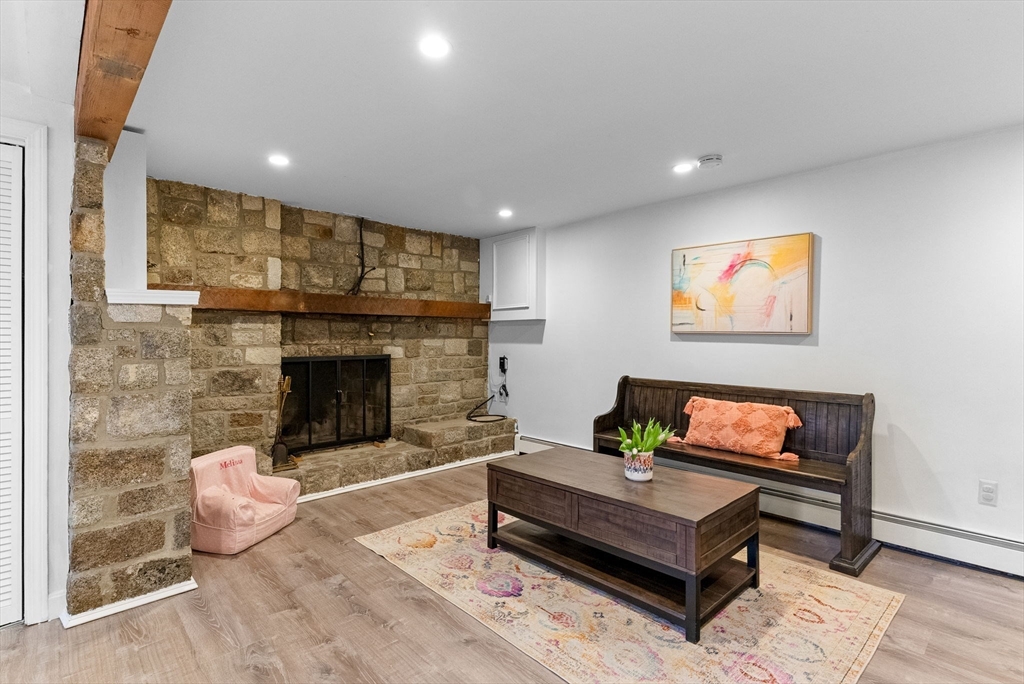 60 Goshen Road Dedham, MA 02026 - Photo 20 of 37 a living room with furniture and a fireplace