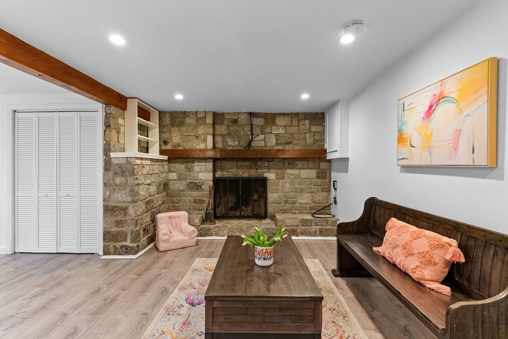 60 Goshen Road Dedham, MA 02026 - Photo 21 of 37 a living room with furniture and a fireplace