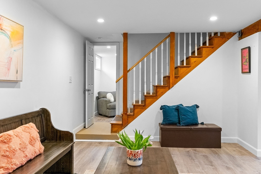 60 Goshen Road Dedham, MA 02026 - Photo 23 of 37 a living room with furniture and stairs