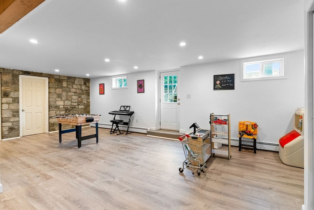 60 Goshen Road Dedham, MA 02026 - Photo 24 of 37 a living room with furniture and a wooden floor