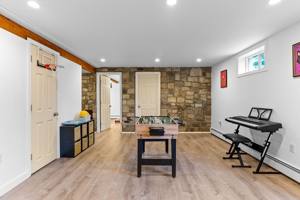 60 Goshen Road Dedham, MA 02026 - Photo 25 of 37 a living room with furniture and a wooden floor