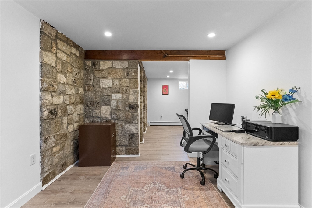 60 Goshen Road Dedham, MA 02026 - Photo 28 of 37 a workspace with furniture and a potted plant