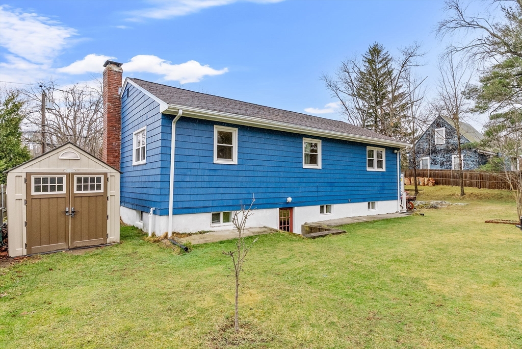60 Goshen Road Dedham, MA 02026 - Photo 31 of 37 a view of a house with a yard and a tree