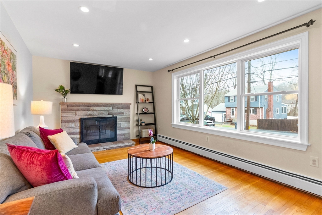 60 Goshen Road Dedham, MA 02026 - Photo 5 of 37 a living room with furniture fireplace and a flat screen tv