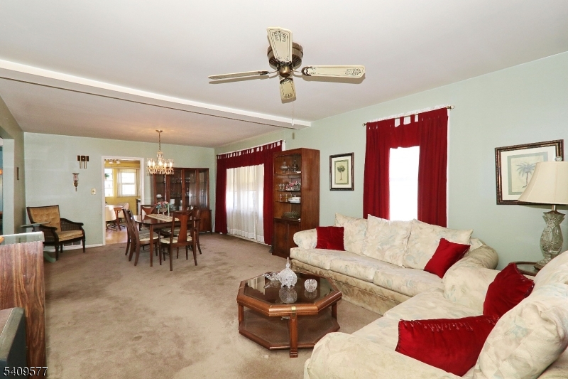 587 Thoreau Terrace Union, NJ 07083 - Photo 4 of 27 a living room with furniture and a large window
