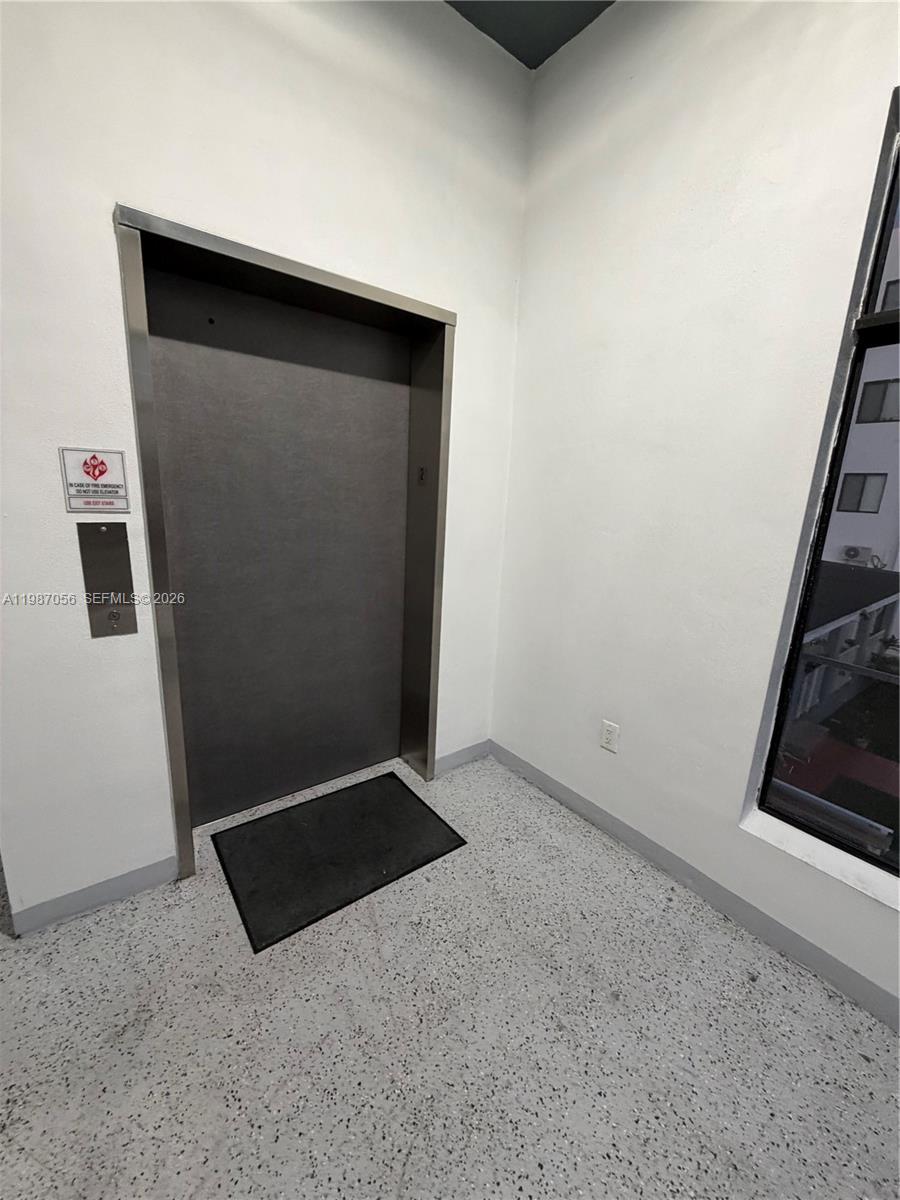 859 East 24th Street, Unit 404 Hialeah, FL 33013 - Photo 17 of 18 a view of an empty room and utility room
