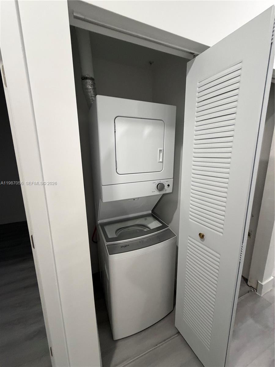 859 East 24th Street, Unit 404 Hialeah, FL 33013 - Photo 5 of 18 a utility room with dryer and washer