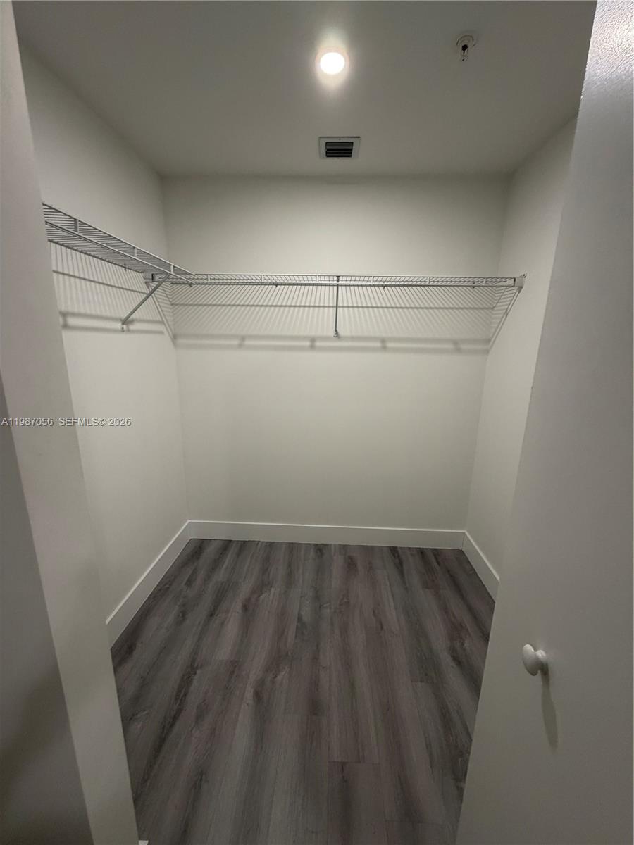 859 East 24th Street, Unit 404 Hialeah, FL 33013 - Photo 10 of 18 a view of a room with racks on the wall