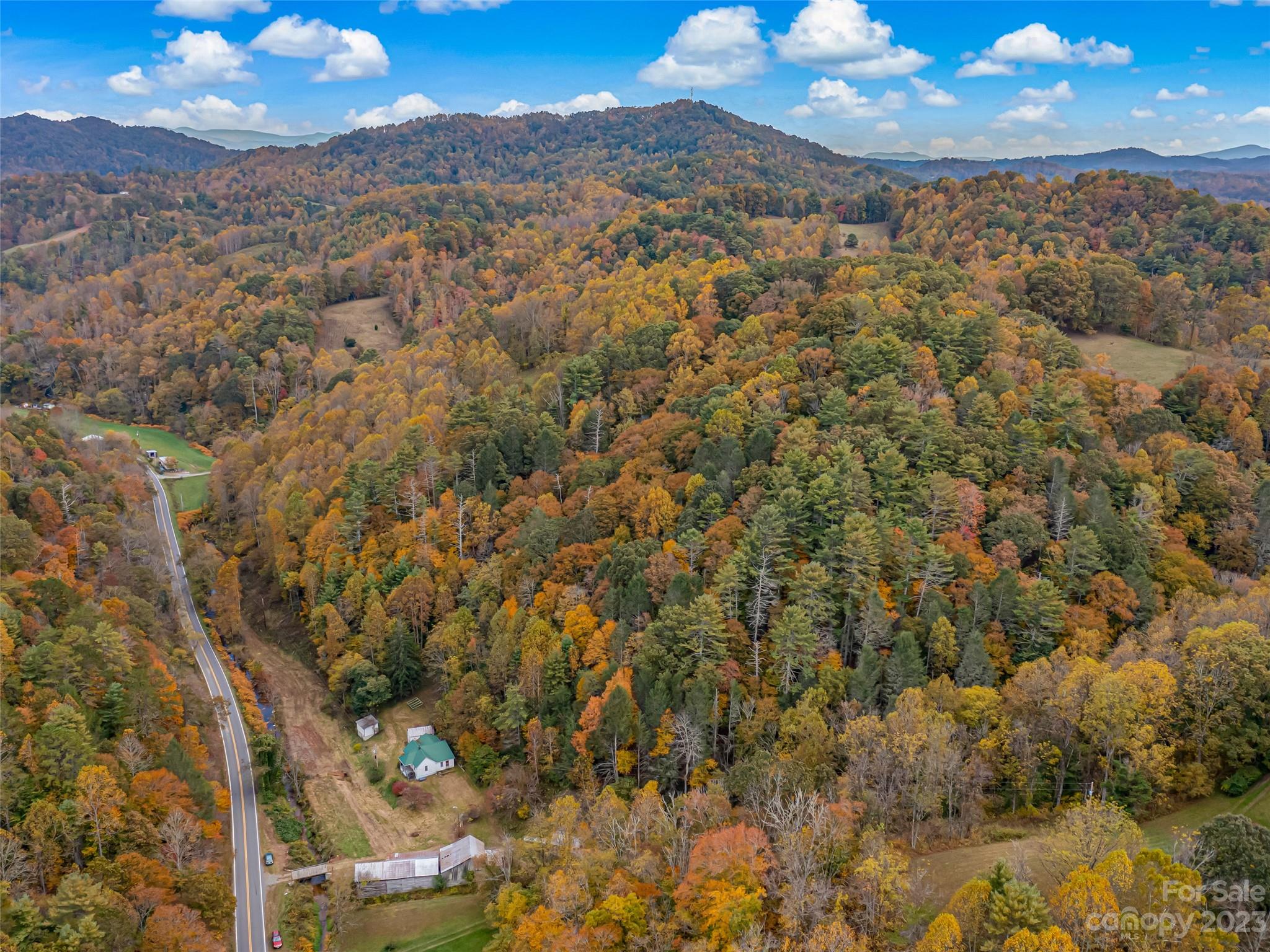 693 Sharp Hollow Road Marshall, NC 28753 - Photo 28 of 46 a view of a city with mountains in the background