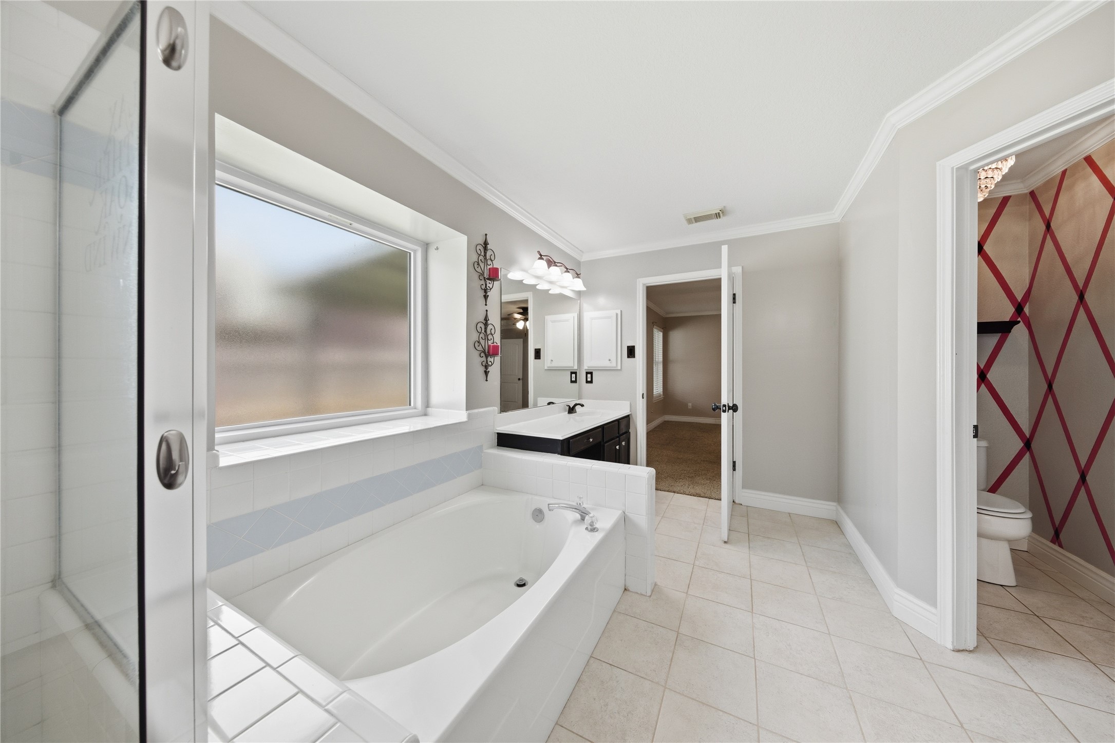 13506 Spring Court Tomball, TX 77375 - Photo 20 of 37 a bathroom with a bathtub and a shower