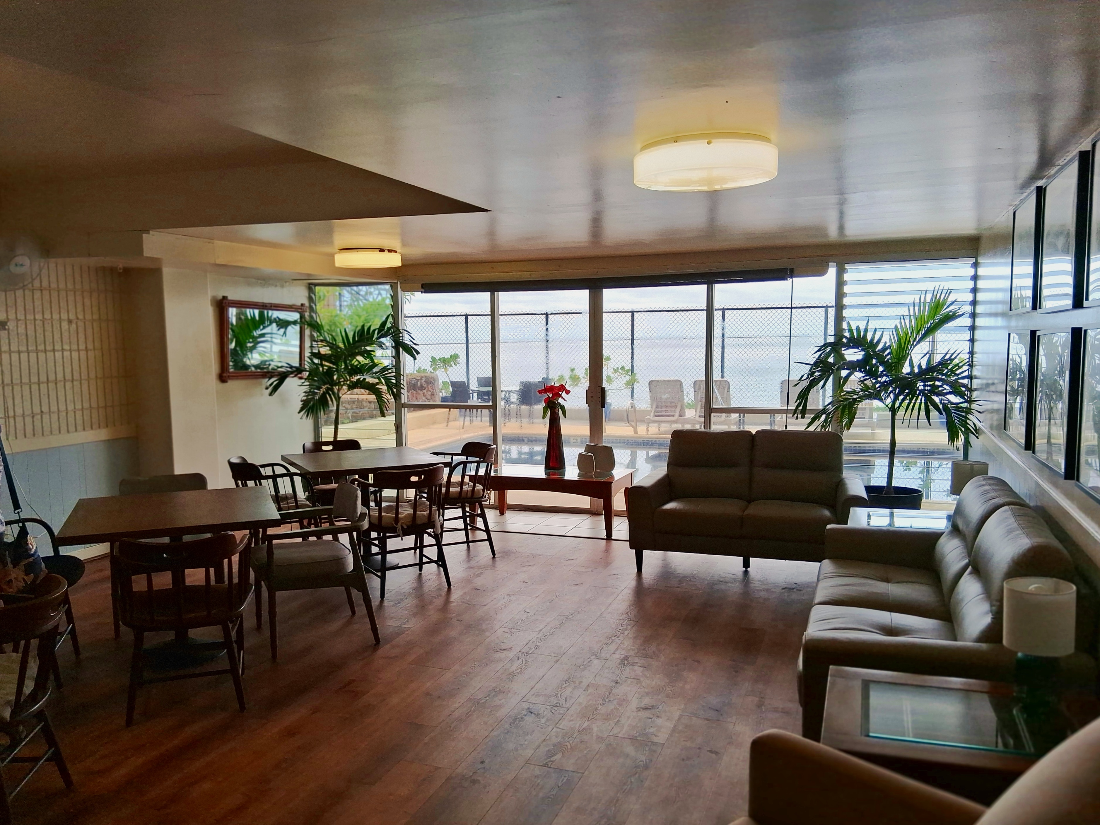 84 Pukihae Street, Unit 404 Hilo, HI 96720 - Photo 11 of 16 a living room with furniture and a large window