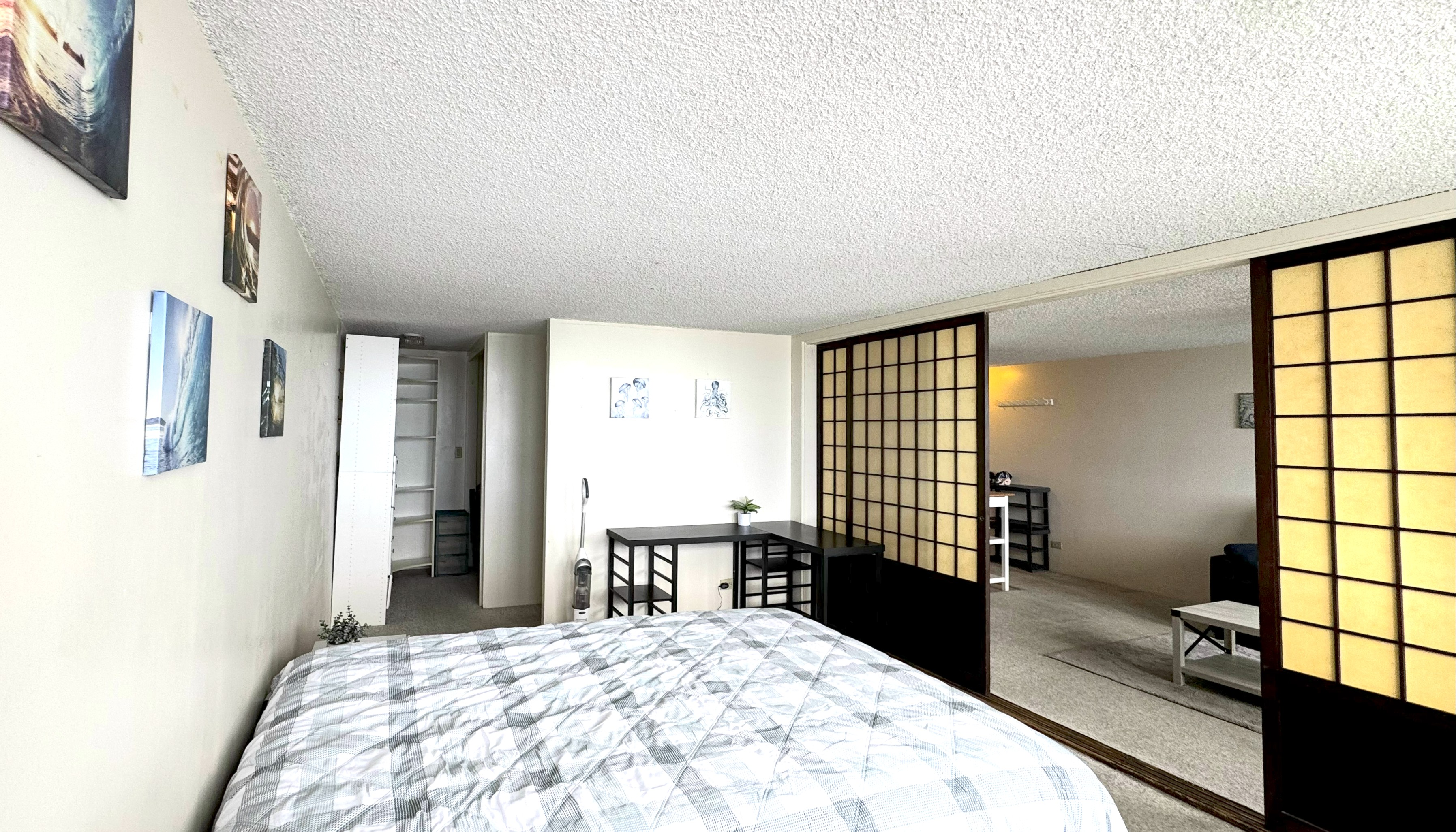 84 Pukihae Street, Unit 404 Hilo, HI 96720 - Photo 6 of 16 a bedroom with a bed and a window