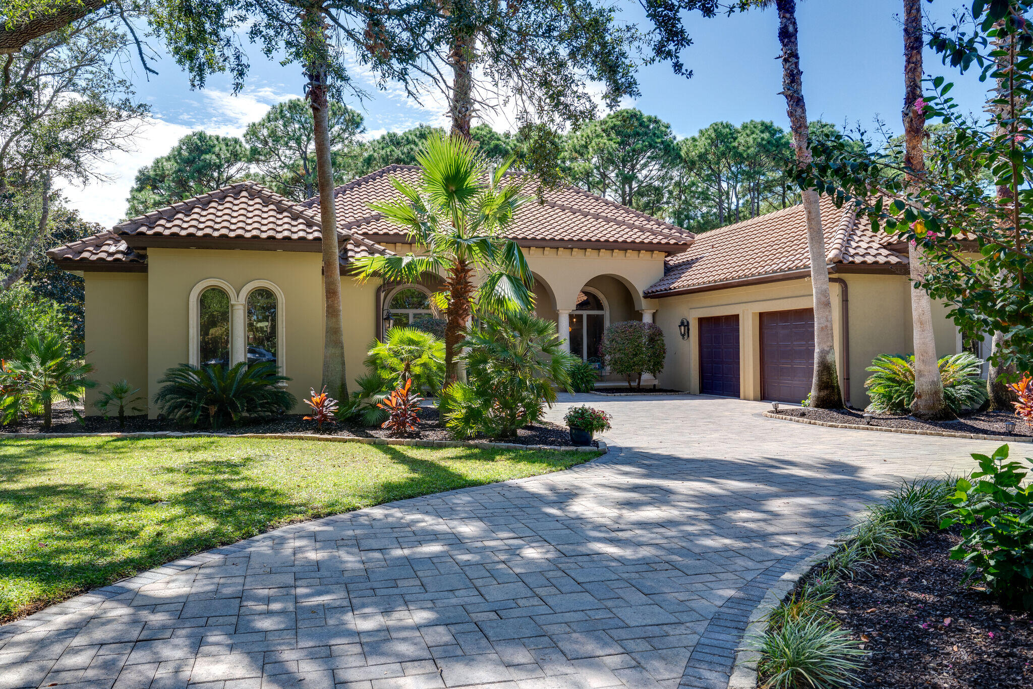 428 Captains Circle Destin, FL 32541 - Photo 2 of 88 a front view of a house with a yard and garage