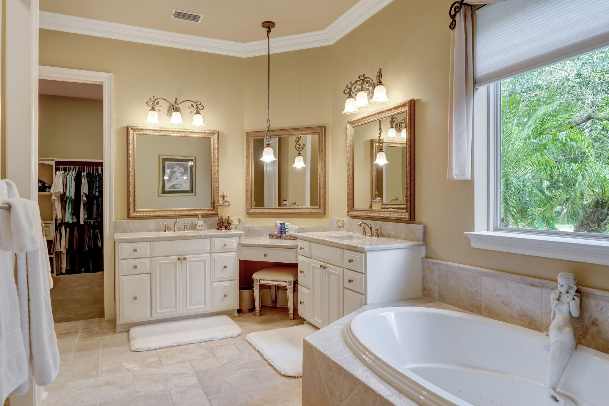 428 Captains Circle Destin, FL 32541 - Photo 25 of 88 a spacious bathroom with a granite countertop tub double vanity sink and a large mirror