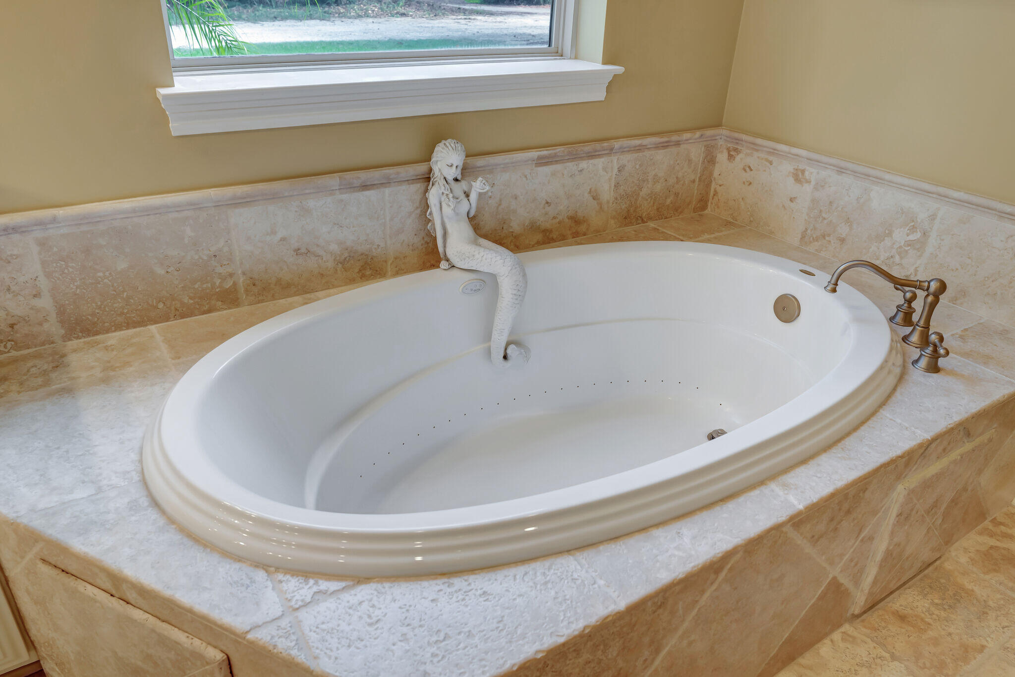 428 Captains Circle Destin, FL 32541 - Photo 27 of 88 a bathroom with a tub and a window