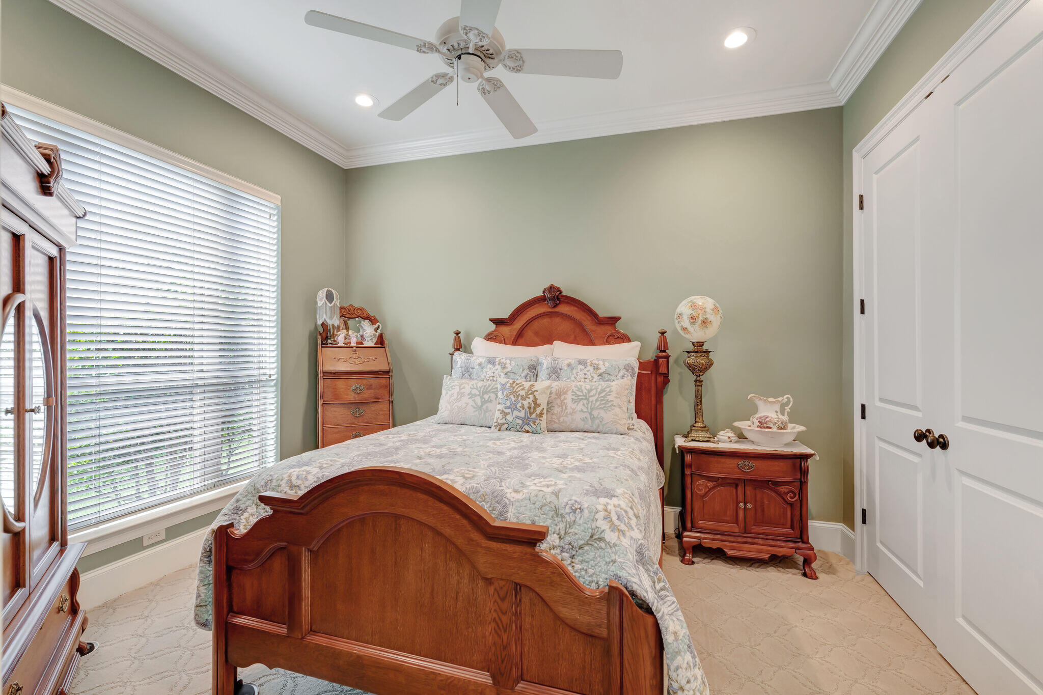 428 Captains Circle Destin, FL 32541 - Photo 32 of 88 a bedroom with a bed and a chandelier