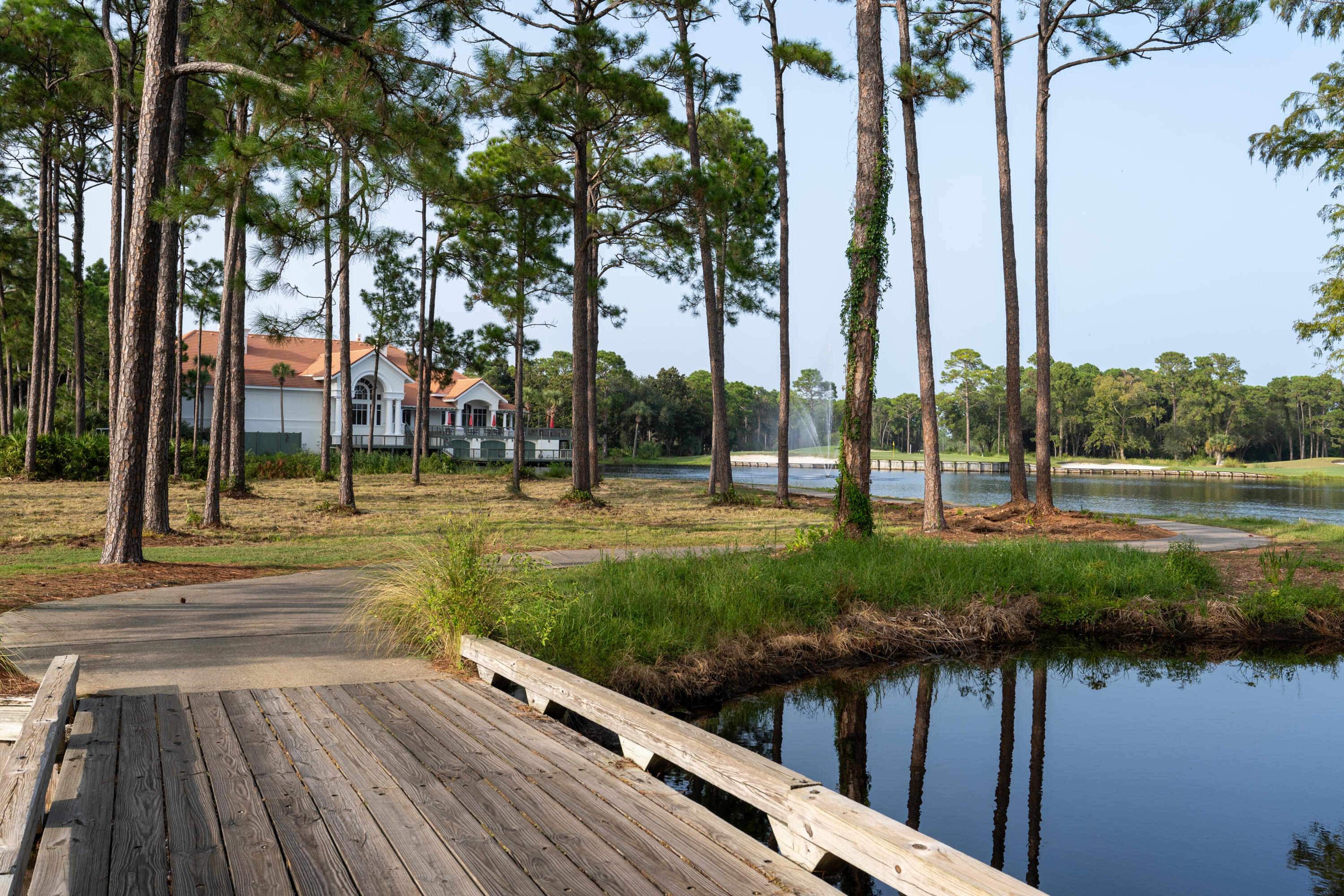 428 Captains Circle Destin, FL 32541 - Photo 71 of 88 a view of a park with large trees and a pathway