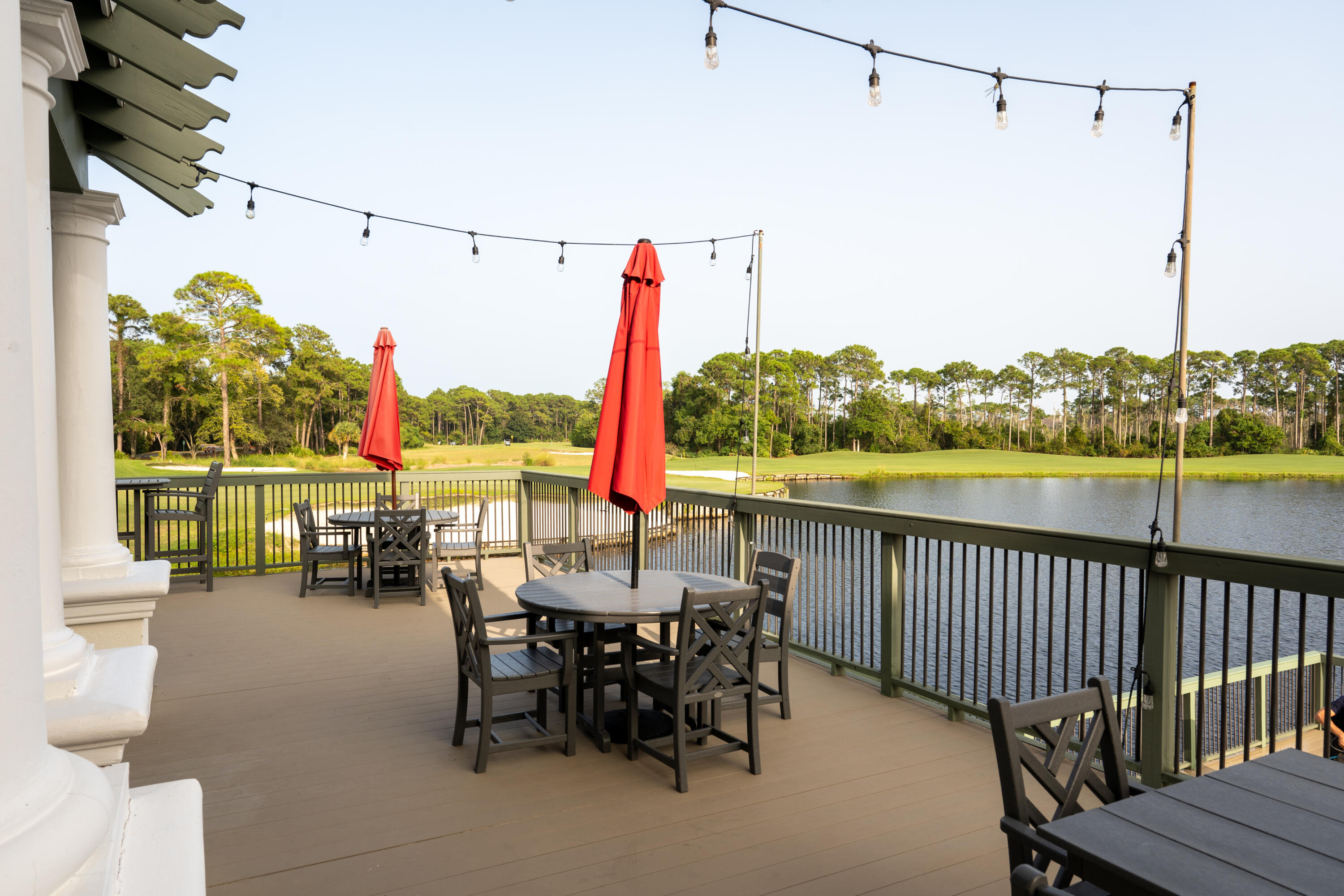 428 Captains Circle Destin, FL 32541 - Photo 81 of 88 a view of a chairs and table in patio with a lake view